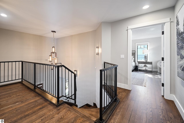 5568 Lakeview Dr, Interlochen, MI 49643 - stairs with hardwood / wood-style floors, recessed lighting, a chandelier, and baseboards