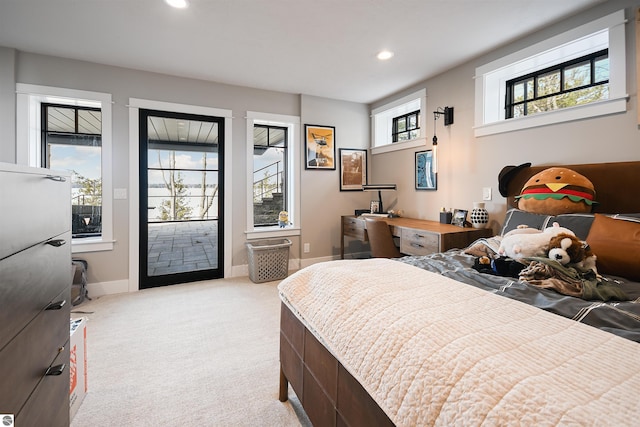5568 Lakeview Dr, Interlochen, MI 49643 - carpeted bedroom with access to exterior, recessed lighting, and baseboards