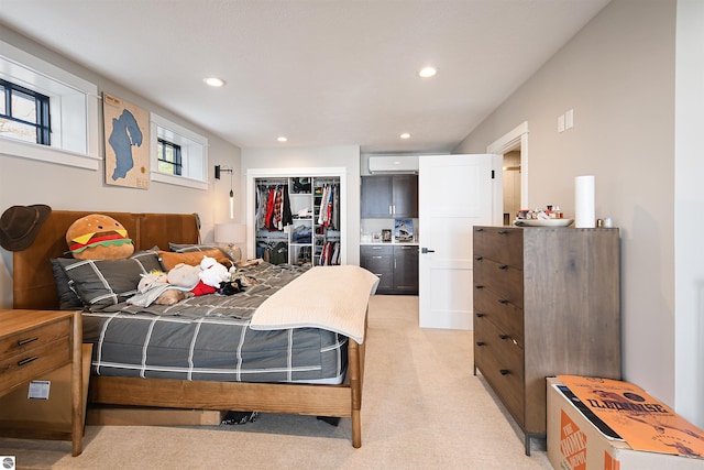 5568 Lakeview Dr, Interlochen, MI 49643 - bedroom featuring a closet, recessed lighting, a wall mounted AC, and light carpet
