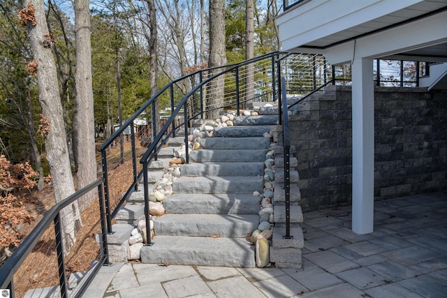 5568 Lakeview Dr, Interlochen, MI 49643 - view of patio featuring stairs