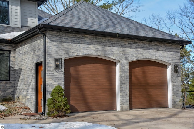 5568 Lakeview Dr, Interlochen, MI 49643 - garage with concrete driveway