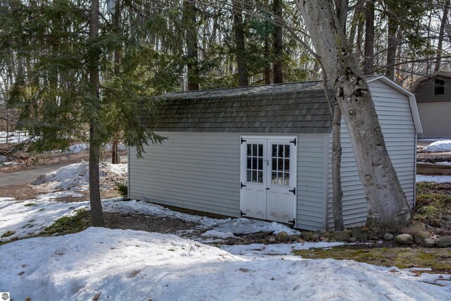 5568 Lakeview Dr, Interlochen, MI 49643 - snow covered structure with an outbuilding