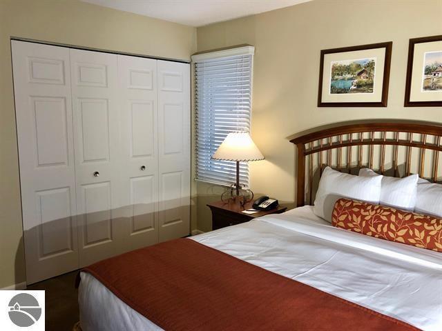 5525 Golfview Ct Unit 10, Williamsburg, MI 49690 - bedroom featuring a closet