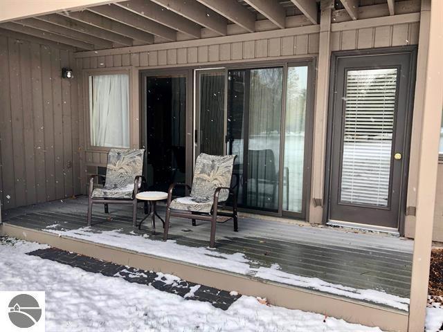 5525 Golfview Ct Unit 10, Williamsburg, MI 49690 - view of snow covered deck
