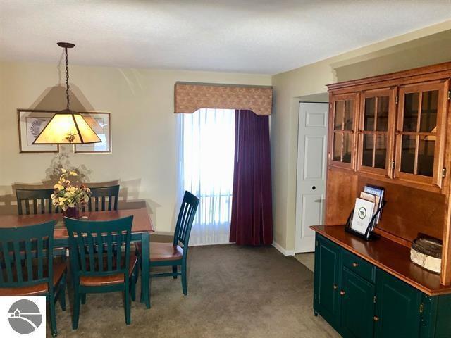 5525 Golfview Ct Unit 10, Williamsburg, MI 49690 - view of carpeted dining space