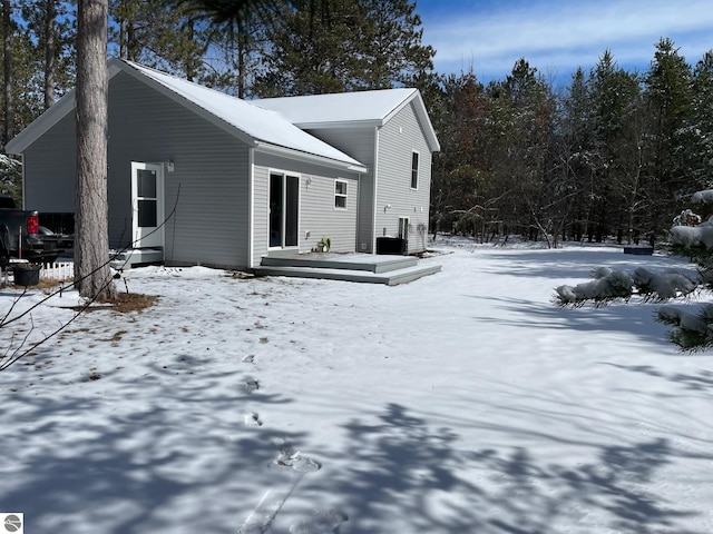 11893 Lillian Lee Dr, Interlochen, MI 49643 - view of snowy exterior featuring a wooden deck