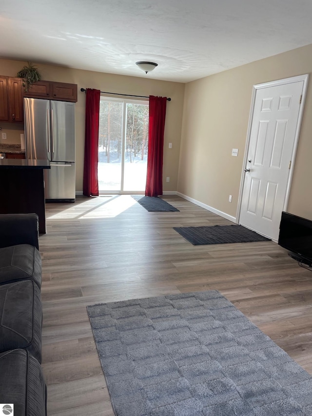 11893 Lillian Lee Dr, Interlochen, MI 49643 - living room with baseboards and light wood-type flooring
