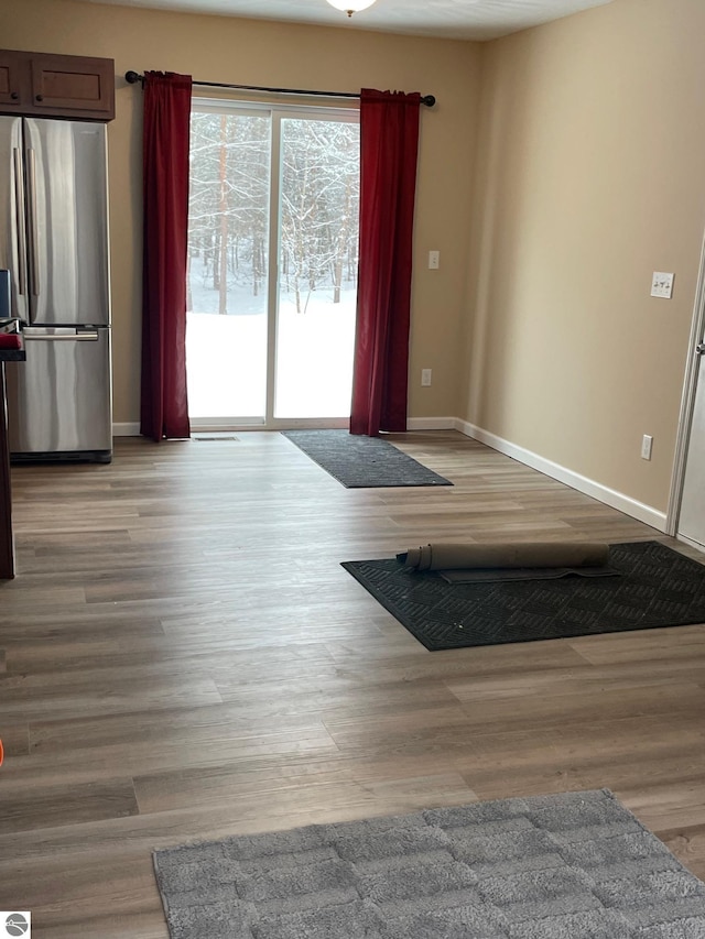 11893 Lillian Lee Dr, Interlochen, MI 49643 - living room with baseboards and light wood-style flooring