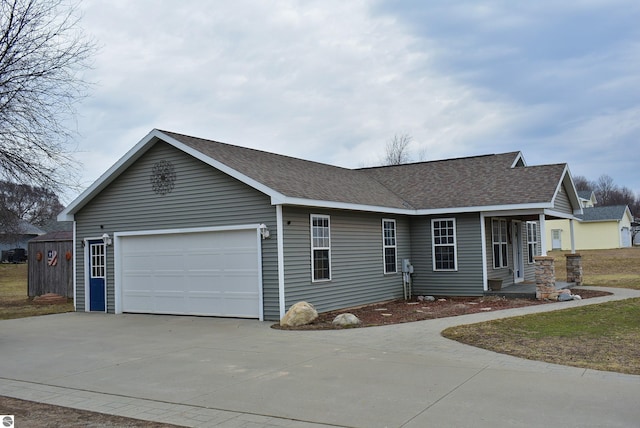 single story home with a garage, roof with shingles, and driveway