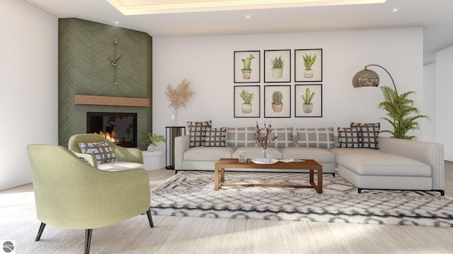 living room with recessed lighting, wood finished floors, and a large fireplace
