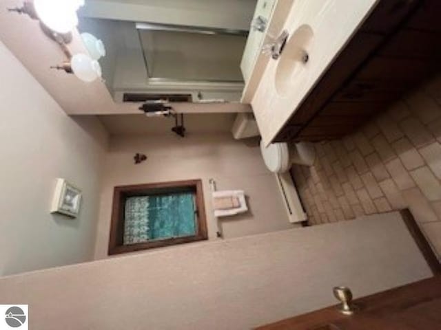 5016 Michabou Rd, Frankfort, MI 49635 - bathroom featuring a chandelier