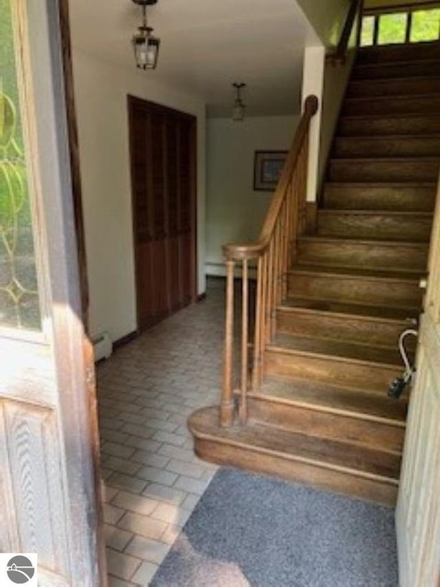 5016 Michabou Rd, Frankfort, MI 49635 - staircase featuring baseboard heating