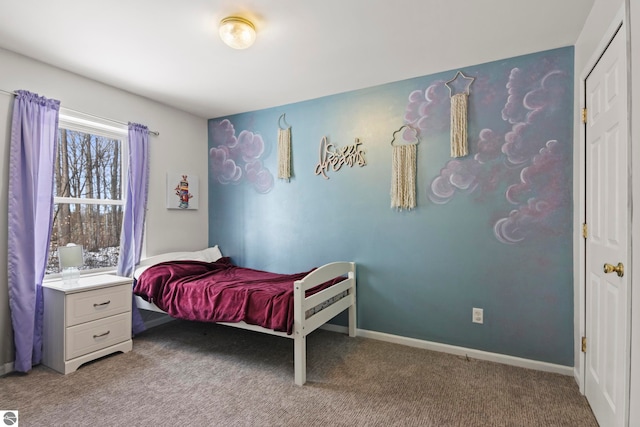 bedroom featuring carpet flooring and baseboards