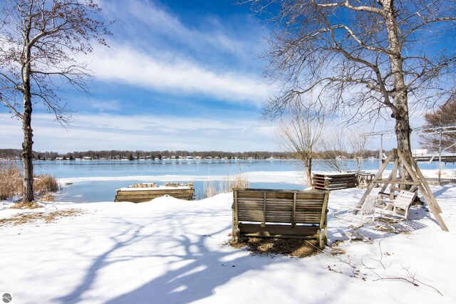 exterior space with a boat dock and a water view