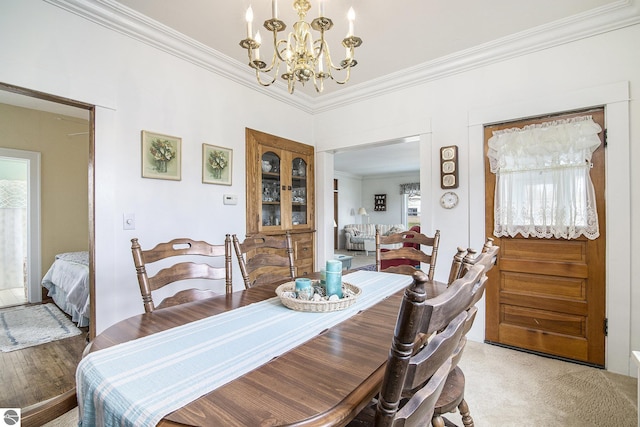 622 Leelanau Ave, Frankfort, MI 49635 - dining room featuring crown molding and an inviting chandelier