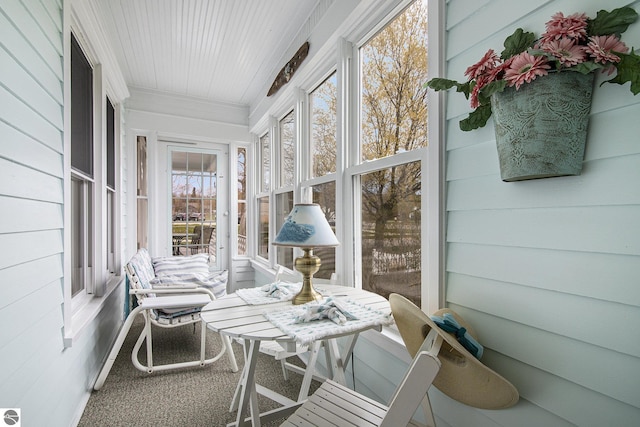 622 Leelanau Ave, Frankfort, MI 49635 - sunroom featuring crown molding and carpet