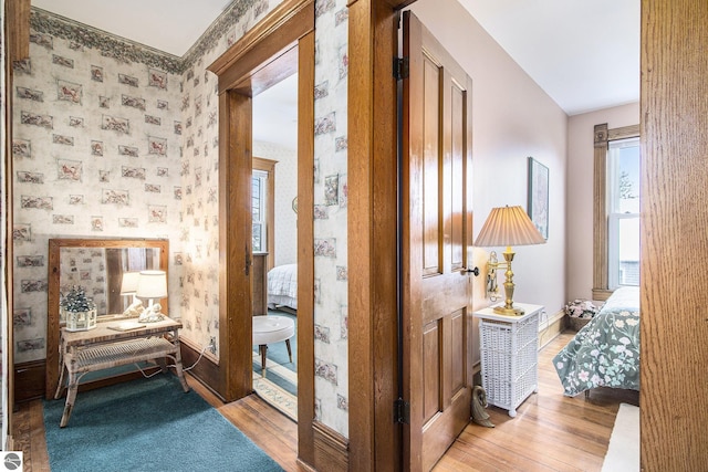 622 Leelanau Ave, Frankfort, MI 49635 - hall with baseboards, light wood-style flooring, and wallpapered walls