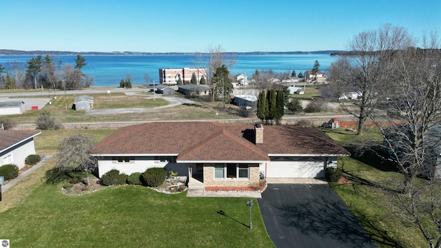 drone / aerial view featuring a water view
