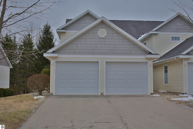 view of front of property featuring driveway and a garage