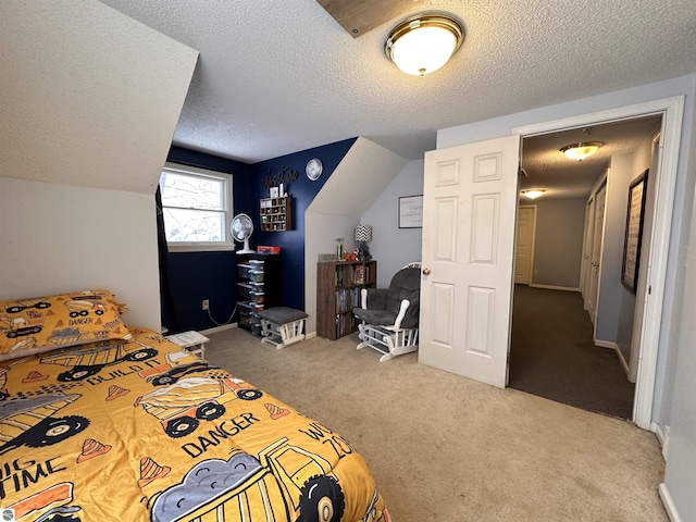 carpeted bedroom featuring baseboards, lofted ceiling, and a textured ceiling