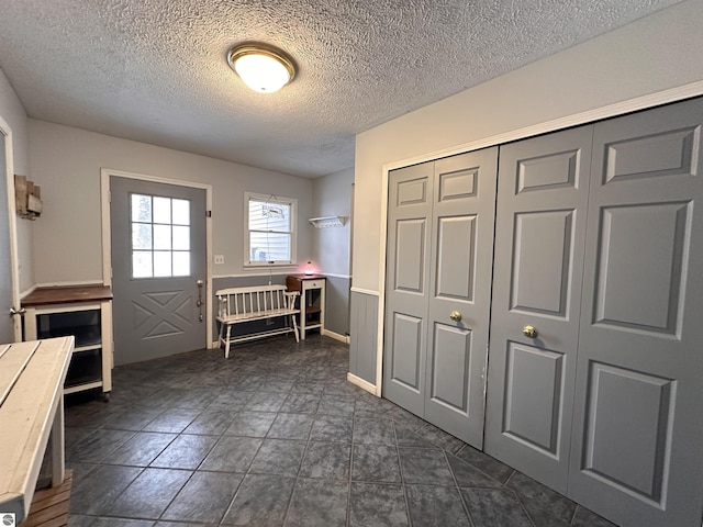 entrance foyer with a textured ceiling