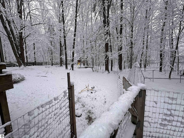 view of yard layered in snow