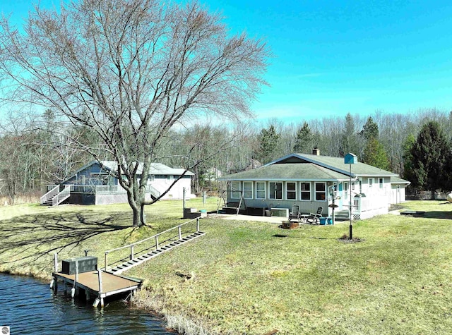 17429 Summit Ct, Barryton, MI 49305 - back of house featuring a lawn and a water view