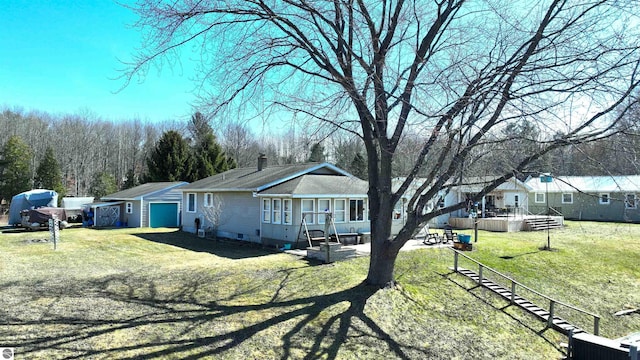17429 Summit Ct, Barryton, MI 49305 - rear view of property featuring a lawn