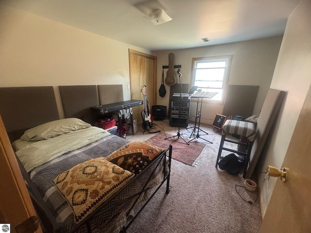 carpeted bedroom with visible vents