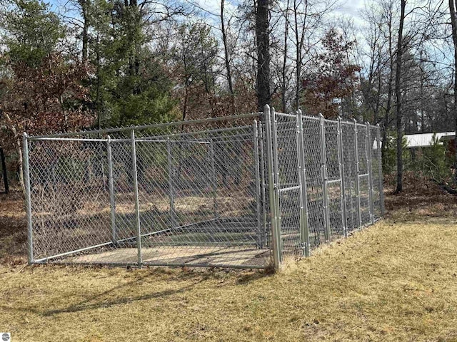 view of gate featuring fence