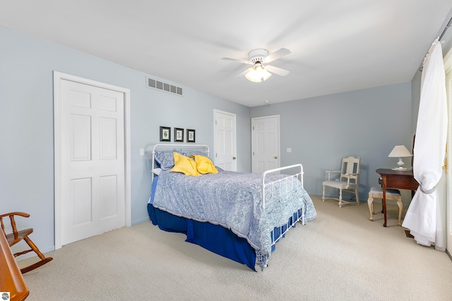 3275 S Sunrise Ln, Lake Leelanau, MI 49653 - bedroom featuring baseboards, ceiling fan, visible vents, and carpet