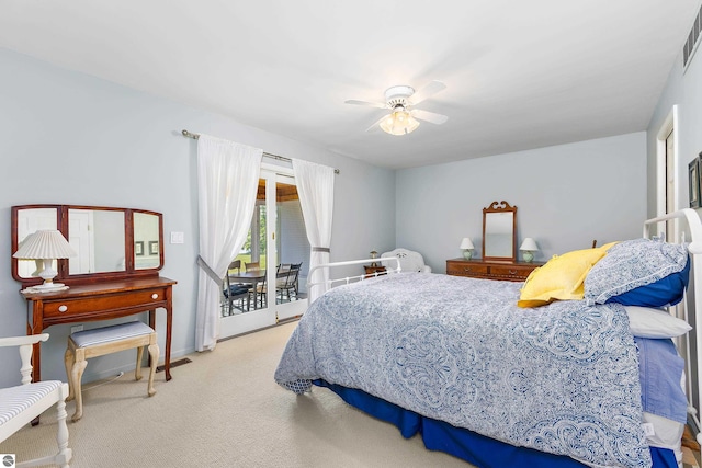 3275 S Sunrise Ln, Lake Leelanau, MI 49653 - carpeted bedroom with access to exterior, visible vents, and ceiling fan