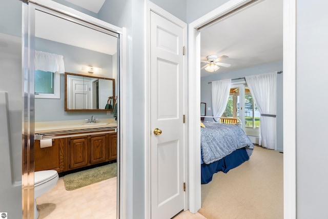 3275 S Sunrise Ln, Lake Leelanau, MI 49653 - ensuite bathroom with ensuite bath, ceiling fan, tile patterned floors, and vanity