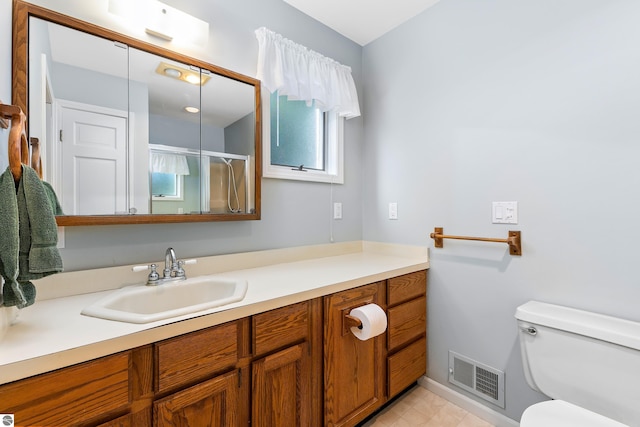 3275 S Sunrise Ln, Lake Leelanau, MI 49653 - full bathroom with a shower stall, visible vents, toilet, and vanity