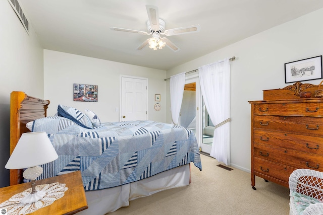3275 S Sunrise Ln, Lake Leelanau, MI 49653 - bedroom featuring carpet flooring, a ceiling fan, access to exterior, and visible vents