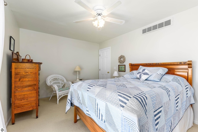 3275 S Sunrise Ln, Lake Leelanau, MI 49653 - bedroom with light carpet, visible vents, and a ceiling fan