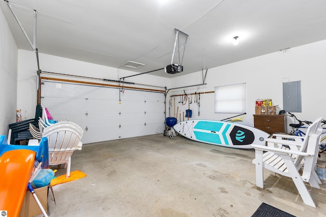 3275 S Sunrise Ln, Lake Leelanau, MI 49653 - garage with electric panel and a garage door opener