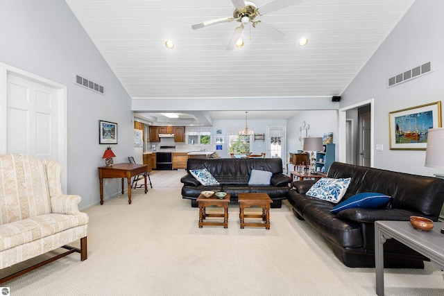3275 S Sunrise Ln, Lake Leelanau, MI 49653 - living room featuring a ceiling fan, high vaulted ceiling, light colored carpet, and visible vents