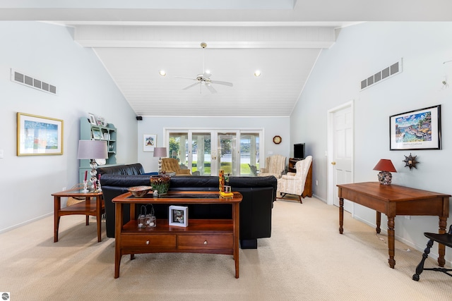 3275 S Sunrise Ln, Lake Leelanau, MI 49653 - living room with beam ceiling, light colored carpet, and visible vents
