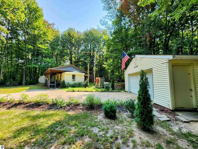 8468 Shorewood Ct, Mancelona, MI 49659 - view of yard featuring an outbuilding