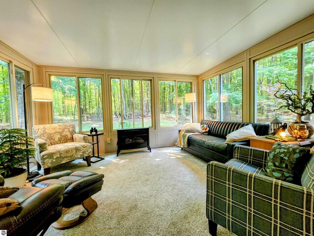 8468 Shorewood Ct, Mancelona, MI 49659 - sunroom / solarium featuring carpet floors and lofted ceiling