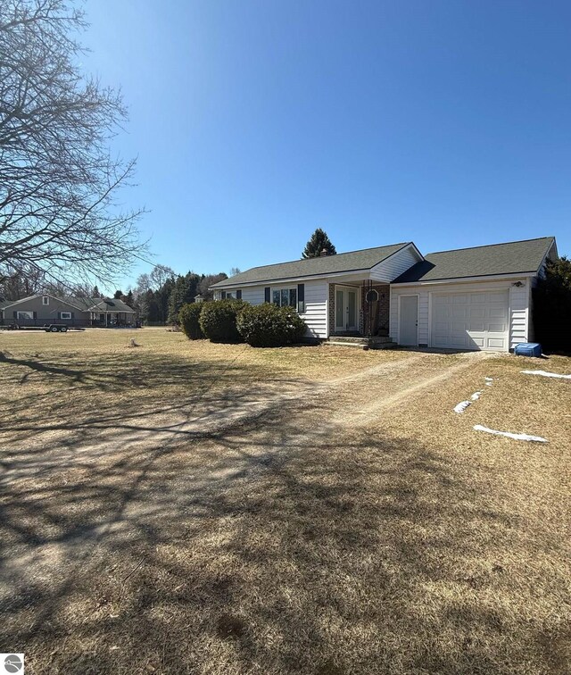6133 W Airline Rd, Weidman, MI 48893 - view of front of property with a garage
