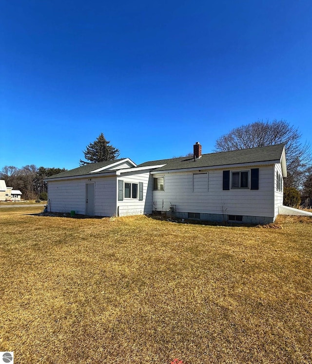 6133 W Airline Rd, Weidman, MI 48893 - rear view of property with a chimney and a yard