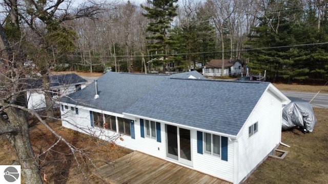 4432 E Cedar Lake Dr, Greenbush, MI 48738 - rear view of house featuring a shingled roof and a deck