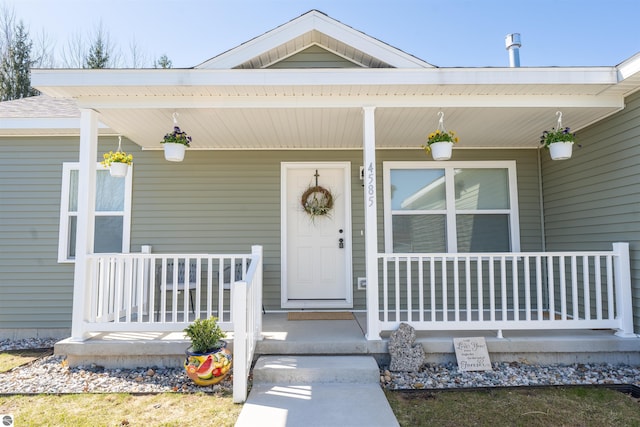 doorway to property featuring a porch