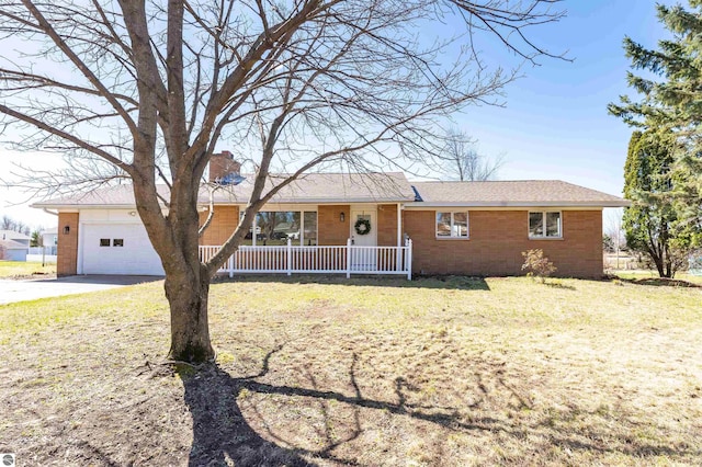 ranch-style home with a front yard, driveway, a porch, and a chimney