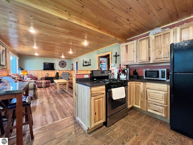 160 White Birch Ln, Cadillac, MI 49601 - kitchen featuring dark wood-style flooring, wood ceiling, appliances with stainless steel finishes, and a peninsula