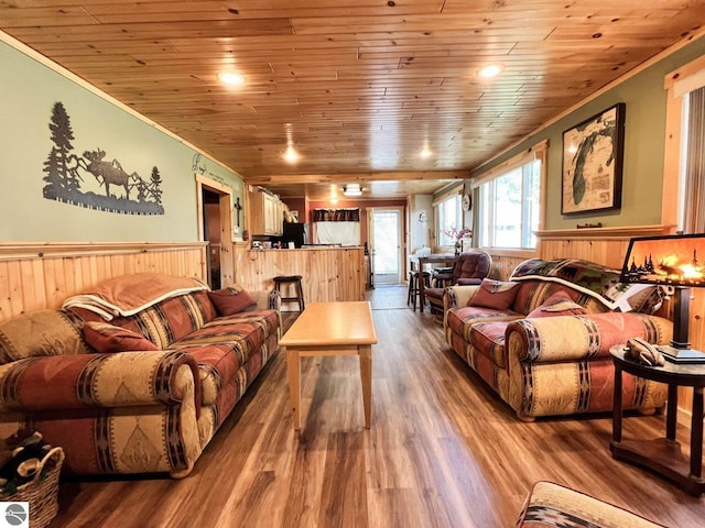 160 White Birch Ln, Cadillac, MI 49601 - living room with wainscoting, crown molding, wood finished floors, and wood ceiling