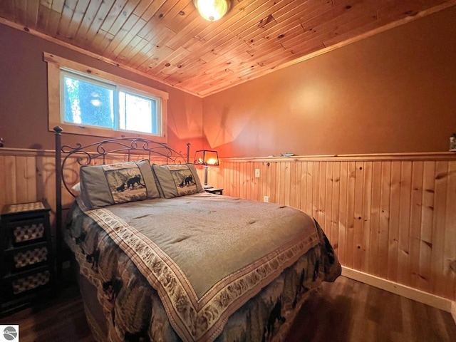160 White Birch Ln, Cadillac, MI 49601 - bedroom with wood finished floors, wood ceiling, wood walls, and wainscoting