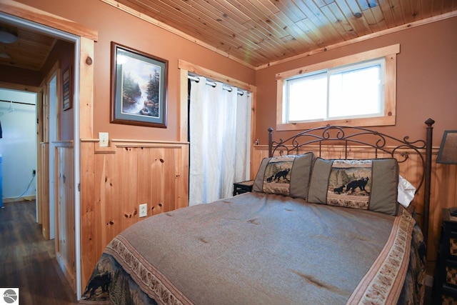 160 White Birch Ln, Cadillac, MI 49601 - bedroom featuring a wainscoted wall, wood finished floors, and wood ceiling